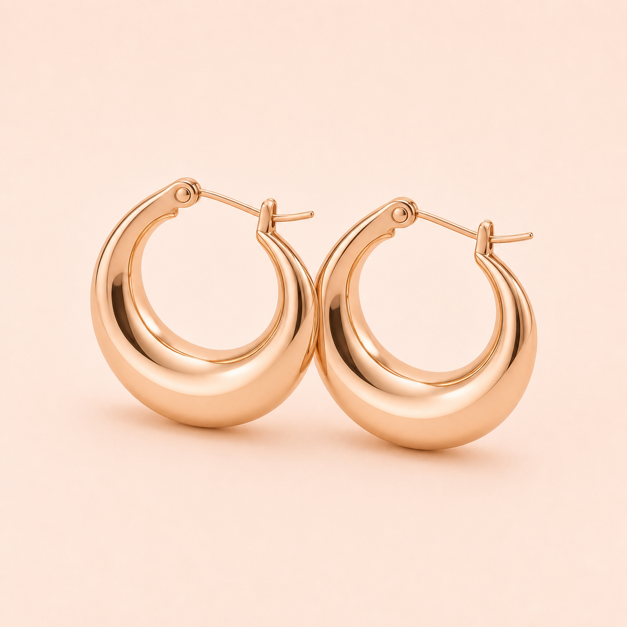 Molten Crescent Hoops clean product photo on pale rose background